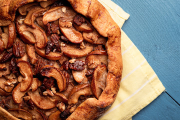 Homemade apple galette with pecan nuts. Homemade autumn dessert