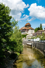 Fototapeta na wymiar view of the historic half-timbered medieval castle and Murg river in the city of Frauenfeld