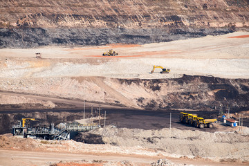 Part of a coal mine pit with big mining truck working
