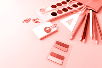 Back to school. The various stationery on light pink background.