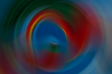 Soft ripple action of sound sonic wave formed in centre, colourful ranged from blue, red, green, orange and yellow rounded and mixed in background. Abstract in shape, form and meaning and inspiration.
