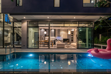 night exterior home with swimming pool in the house - obrazy, fototapety, plakaty