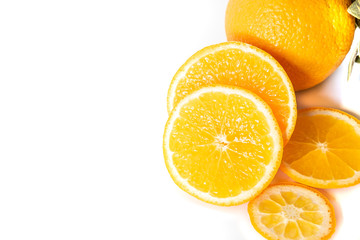 Sliced orange with green leaf isolated on white background