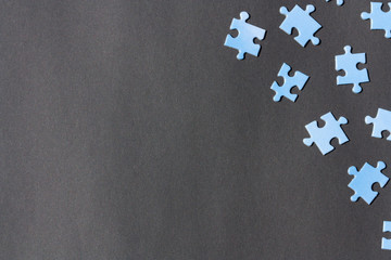 Puzzle pieces on a dark background.