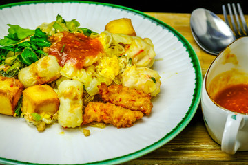 a fried noodle with vegetarian meatballs with sauce in Japanese style
