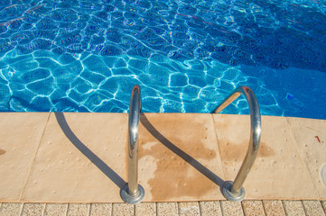 swimming pool with stainless steel ladder