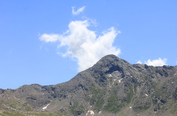panorama of mountains with rocks and vegetations in Summer in Italy