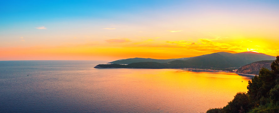 Panoramic view from above to the Adriatic sea coastline with Jaz beach at sunset time, Montenegro