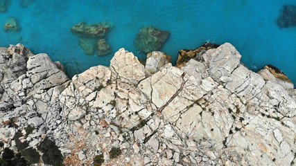 Rocks facing the sea, top view from drone