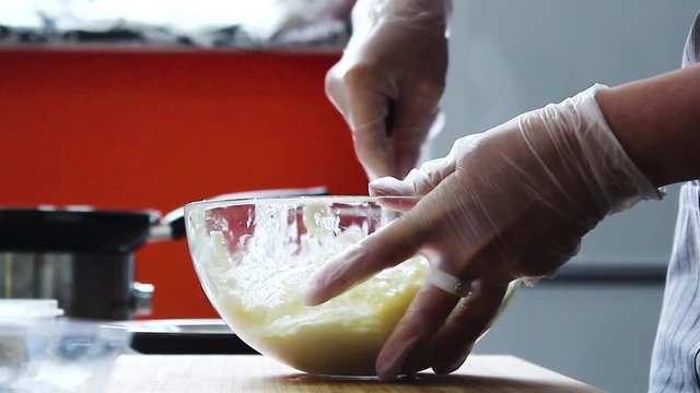 the cook mixes sugar , eggs, cottage cheese, vanilla and prepares cheesecakes