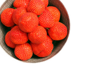 Fresh ripe Strawberries in a bowl - isolated on white with copy space.
