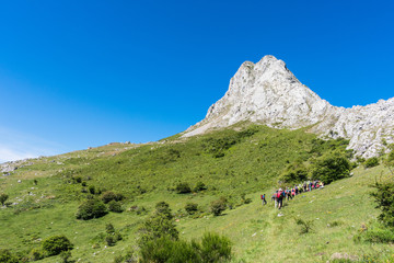 Fototapeta na wymiar footpath in the mountain with walkers