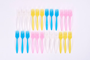  Disposable plastic forks on white background