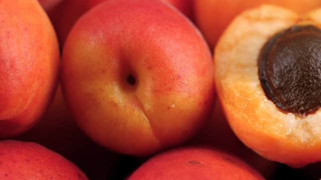 Delicious ripe apricots fruit background, macro tracking shot
