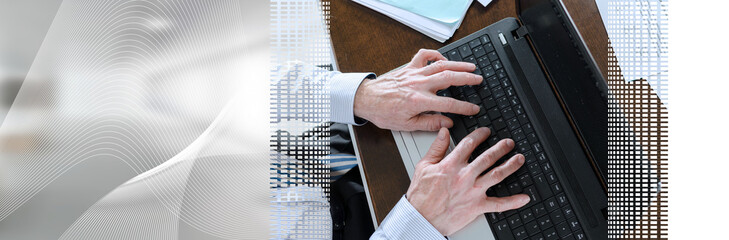 Fototapeta na wymiar Businessman typing on a laptop; panoramic banner
