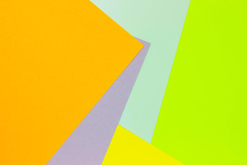 Bright unique colorful background consisting of different saturated colors. Palette of colors. Multicolor background from a paper of different colors. Geometric background of pastel tones.