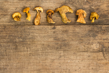 dry mushroom chips on a wooden background