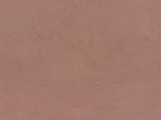 Textured plaster in terracotta color. High resolution seamless texture of stucco for background, pattern, poster, collage, gift wrap, wallpaper, photo layering etc.