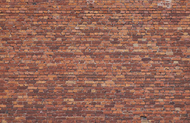 Old weathered red brick wall. High resolution seamless texture for background, pattern, poster,...