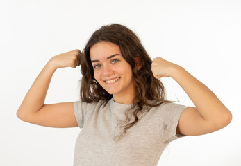 Fototapeta premium Close up portrait of surprised and happy teenager woman celebrating victory and wining lottery