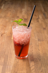 Red drink on wooden background. For fast food restaurant design or fast food menu