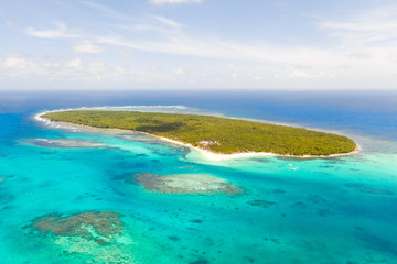 Daco island, Philippines. Tropical island with palm trees and a white sandy beach. Philippine Islands, a top view.