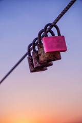 Multi-colored padlocks intertwined