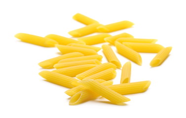 Penne rigate pasta pile isolated on white background
