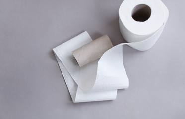 Toilet paper on gray background