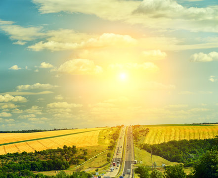 The route stretches upwards and open spaces of different pole with harvested crops along the road. The route Kiev-Odessa. Route E95.