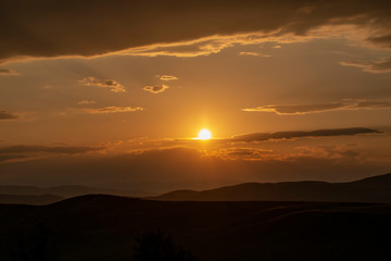 Red sunset with cloudy sky