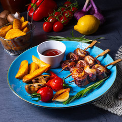 cattle shashlik skewers with grilled vegetables on a caucasian