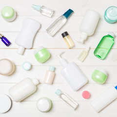 Group of plastic bodycare bottle Flat lay composition with cosmetic products on wooden background empty space for you design. Set of White Cosmetic containers, top view with copy space