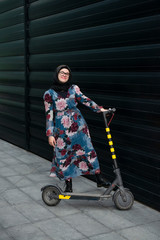 Beautiful woman on a e-scooter
