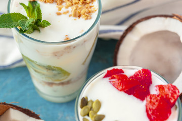 Granola with yogurt and berries for healthy breakfast on a table