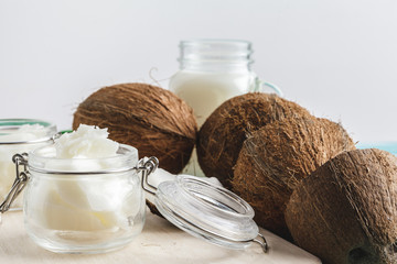 Coconut butter on wooden background. Organic healthy food concept