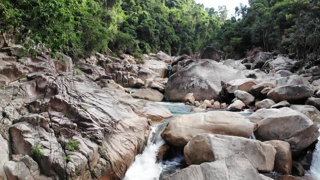 River with Big Stones and Cascades in a Tropical Forest in Vietnam