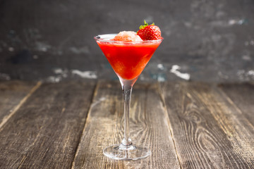 Frozen strawberry cocktail in martini glass. Selective focus.