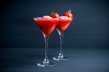 Frozen strawberry cocktail in martini glass. Selective focus.