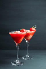 Frozen strawberry cocktail in martini glass. Selective focus.