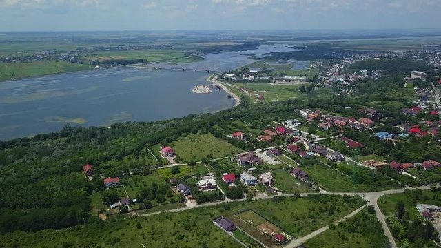Aerial view of Slatina city and river Olt, Romania. Drone flight over the european city in summer day.