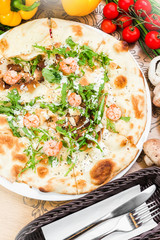 Traditional Italian pizza, vegetables, ingredients. Pizza is cooking in the oven. Pizza menu