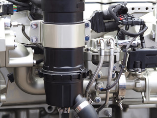 Engine fragment as texture and background. Vehicle hydraulics. powerful tractor engine.