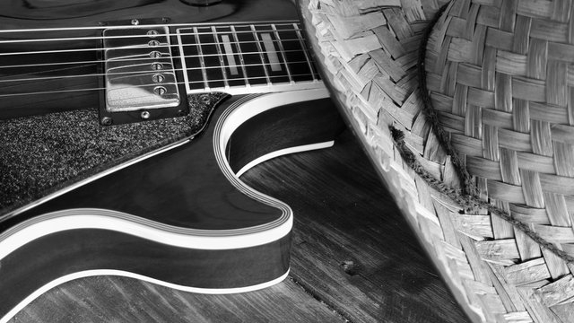 guitar on wooden boards in an old barn