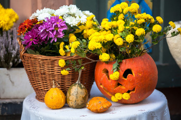 Autumn decoration with pumpkins and flowers on a street in a European city