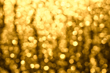 Golden-brown background with abstract blurred highlights. Bokeh in blur.