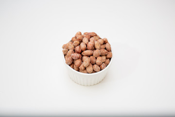 nuts in a bowl isolated on white background