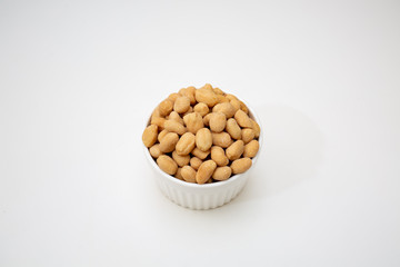 peanuts in a bowl isolated on white background