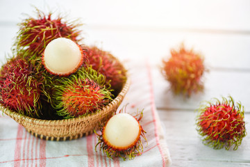 Rambutan peeled in a basket on table background - Fresh rambutan summer fruit from garden in Thailand