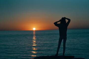 silhouette of a woman at sunset